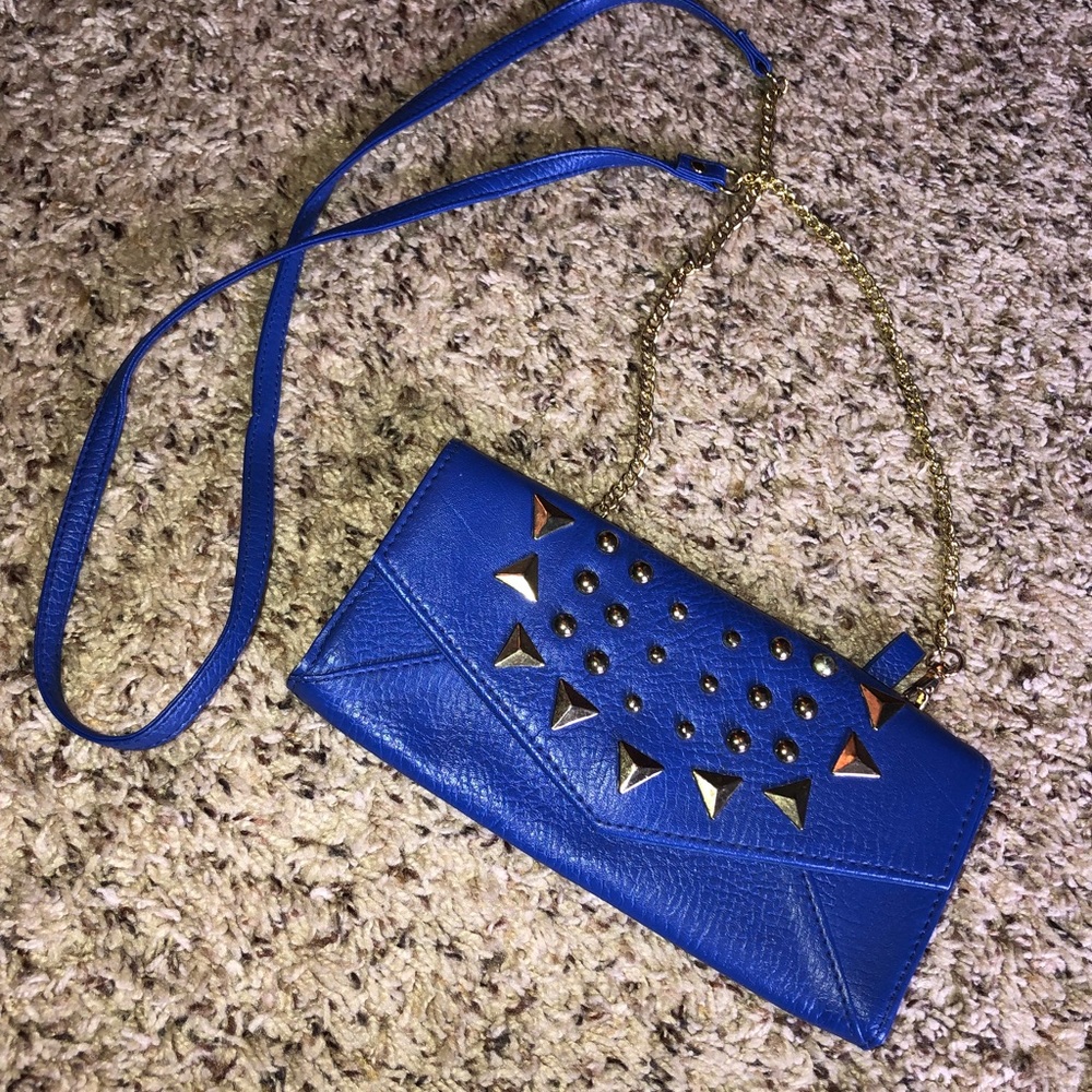 Navy blue purse with gold accents.